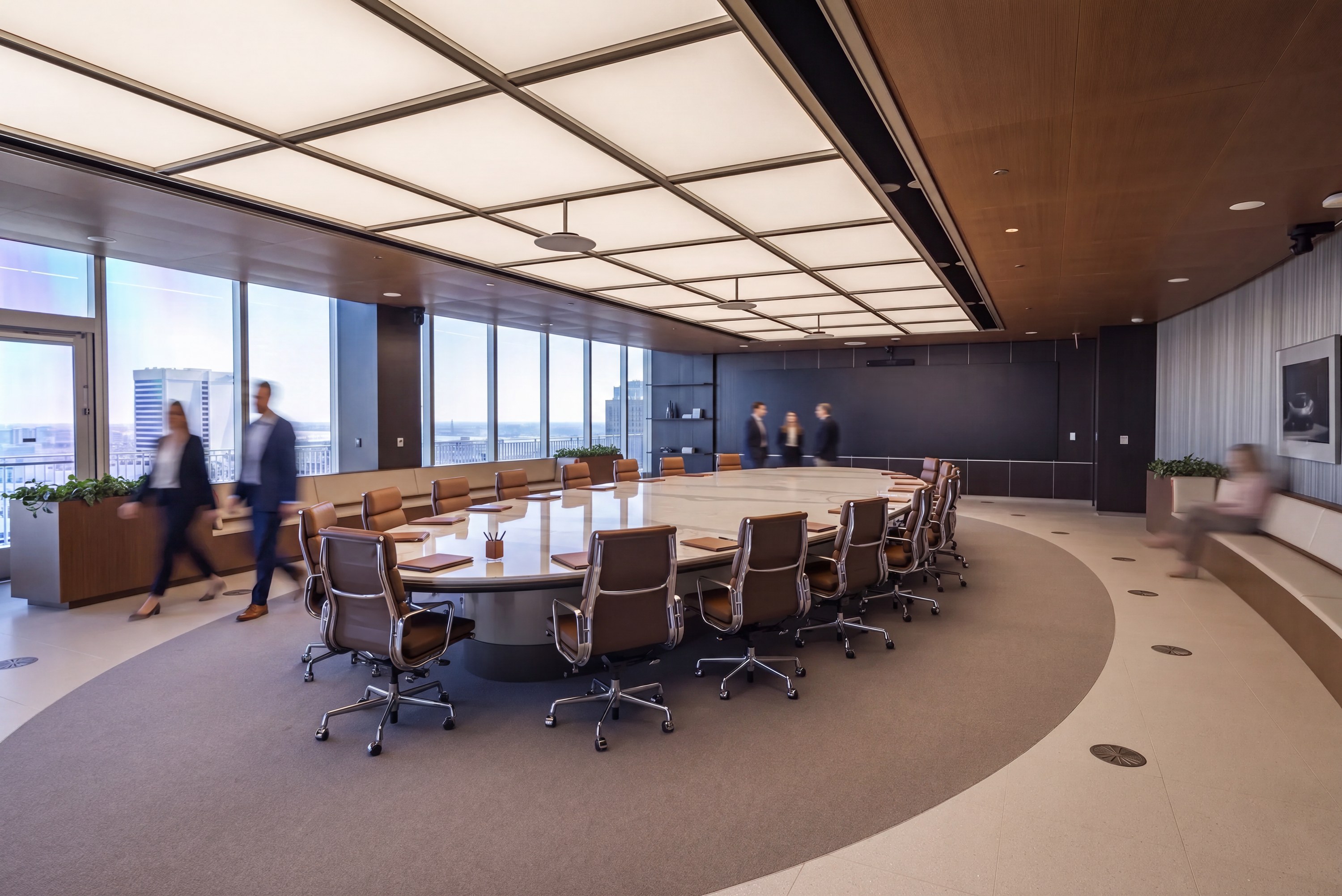 Oval stone table under a coffered light ceiling