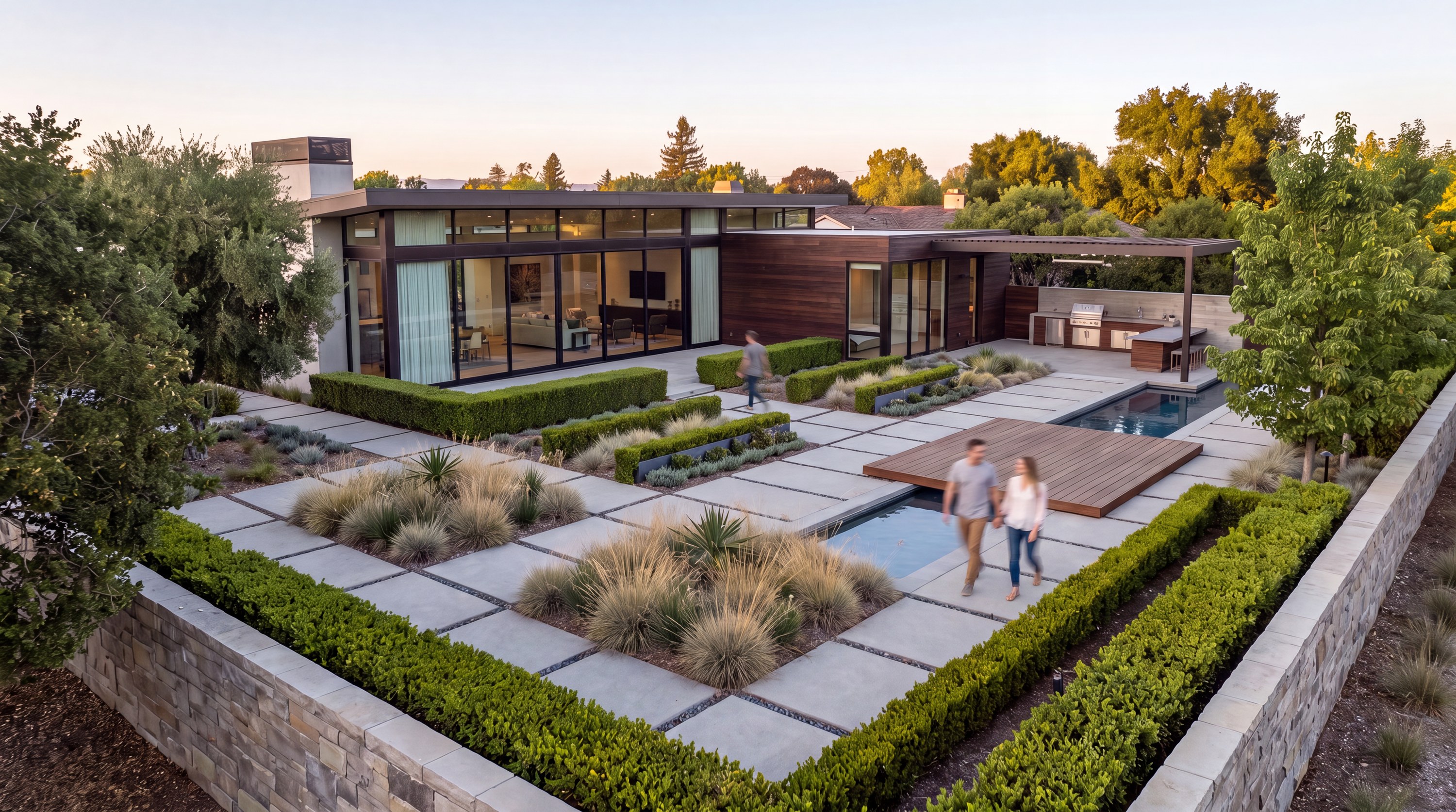 Evening garden with clipped hedges, pools, and a floating deck
